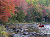 A Man Paddles His Canoe  Seboeis Lake  Millinocket  Maine  USA