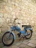 Blue scooter bike by old stone wall  Hvar Town  Hvar Island  Dalmatia  Croatia