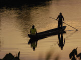 Quichua Indians Poling Dugout Canoe  Amazon Rain Forest  Ecuador
