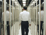 Man Walking Through a Computer Server Room