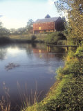Pond with a Small Dock and an Old Red Barn