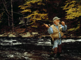 Man Fly-Fishing in a Swift Moving River