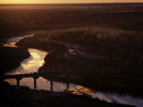 Trucks Cross Between Mexico and the United States over the Rio Grande