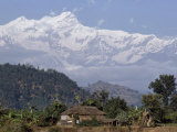 Thatched Farmhouse Lies Below the Himalaya's Annapurna Massif
