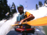 Self Portrait of the Photographer Kayaking Through Rapids