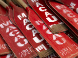 Stacked Oars Near Dragon Boats Ready for Use by Macau Team Members
