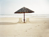 Couple of Deck Chairs with an Umbrella on a Beach in Vietnam