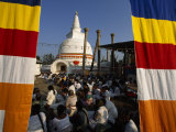 Seated Crowd Gathered Outside a Buddhist Stupa