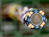 Stack of Gambling Chips Stacked High Above the Game Table