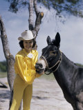 Female Animal Trainer Poses with Her Mule at a Texas Rodeo