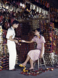 Young Woman Buys Shoes at Manila's Yangco Market
