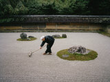 Young Monk Raking the Famous Japanese Rock Garden of Ryoanji Temple