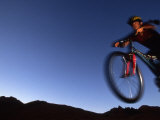 Woman Mountain Biking in the Desert