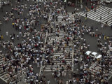 Elevated Scene of Crowds Crossing the Street at an Intersection