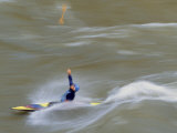 Kayaker Throws His Paddle in the Air Surfing a Standing Wave