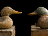 Antique Duck Decoys Sit on an Old Wooden Crate