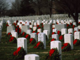 Christmas Wreathes Decorate the Headstones of Fallen Soldiers