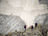 Three Mountaineers Descending to a Glacier
