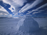 Igloo in a Desolate Arctic Landscape with Dramatic Clouds