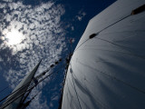 Looking Up the Mast of a Tall Ship to Cumulus Clouds in a Summer Sky