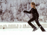 Woman Runs with Snowshoes