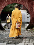 Monk at the Shaolin Temple Carries a Burger King Bag as He Walks