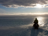 Paul Nicklen Driving a Skidoo on Sea Ice