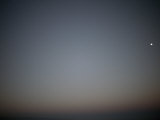Predawn Lightens the Clear Desert Sky Beneath a Setting Moon