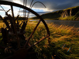 Old Piece of Farm Equipment in a Field Along a Waterway