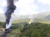 Smoke Rises from the Steam Engine of the Cog Railway