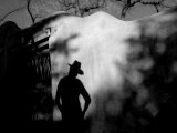 Cowgirl's Shadow on an Adobe Wall