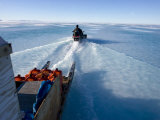 Hunter Traveling over the Wet Spring Ice in the Arctic