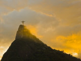 Christ the Redeemer Statue Atop Corcovado in Orange Glow at Sunset