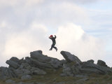 Six Year Old Boy Jumps from Rock to Rock