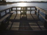 Sunset Sparkles and Casts Shadows on a Peaceful Pier