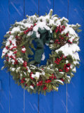 Snow Covered Christmas Wreath Adorns a Blue Door in Santa Fe