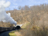 Old Fashioned Steam Train Heads into a Tunnel