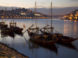 Wine Barrels on Boats in Oporto at Dusk