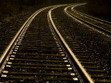 Gleaming Tracks Reflect Sundown Along the Railroad