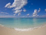 Perfect Beach Day with Blue Skies  Clear Water  Puffy White Clouds