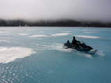 Hunter Traveling over the Wet Spring Ice in the Arctic