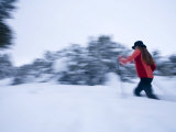 Woman Snowshoes in Deep Snow in Santa Fe  New Mexico