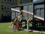 Students Mount French Escutcheons on a Special Train Car