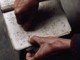 Healer Consults a Manual of Cures