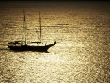 Silhouette of a Double Masted Sailboat on the Water