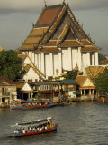 Tourists Arrive in Boats at a Riverside Temple in Bangkok