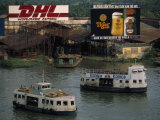 Ferries Take Passengers across a Saigon River