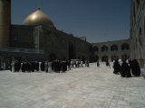 People Gather in the Courtyard of a Mosque
