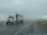 Truck on Route 380 Through a Wet Windshield