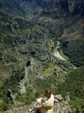 Woman Sits on a Pinnacle Overlooking Tarn River's Rocky Gorge